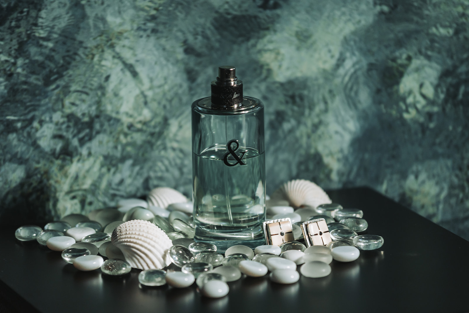 Groom cologne cufflinks and shells styled flatlay