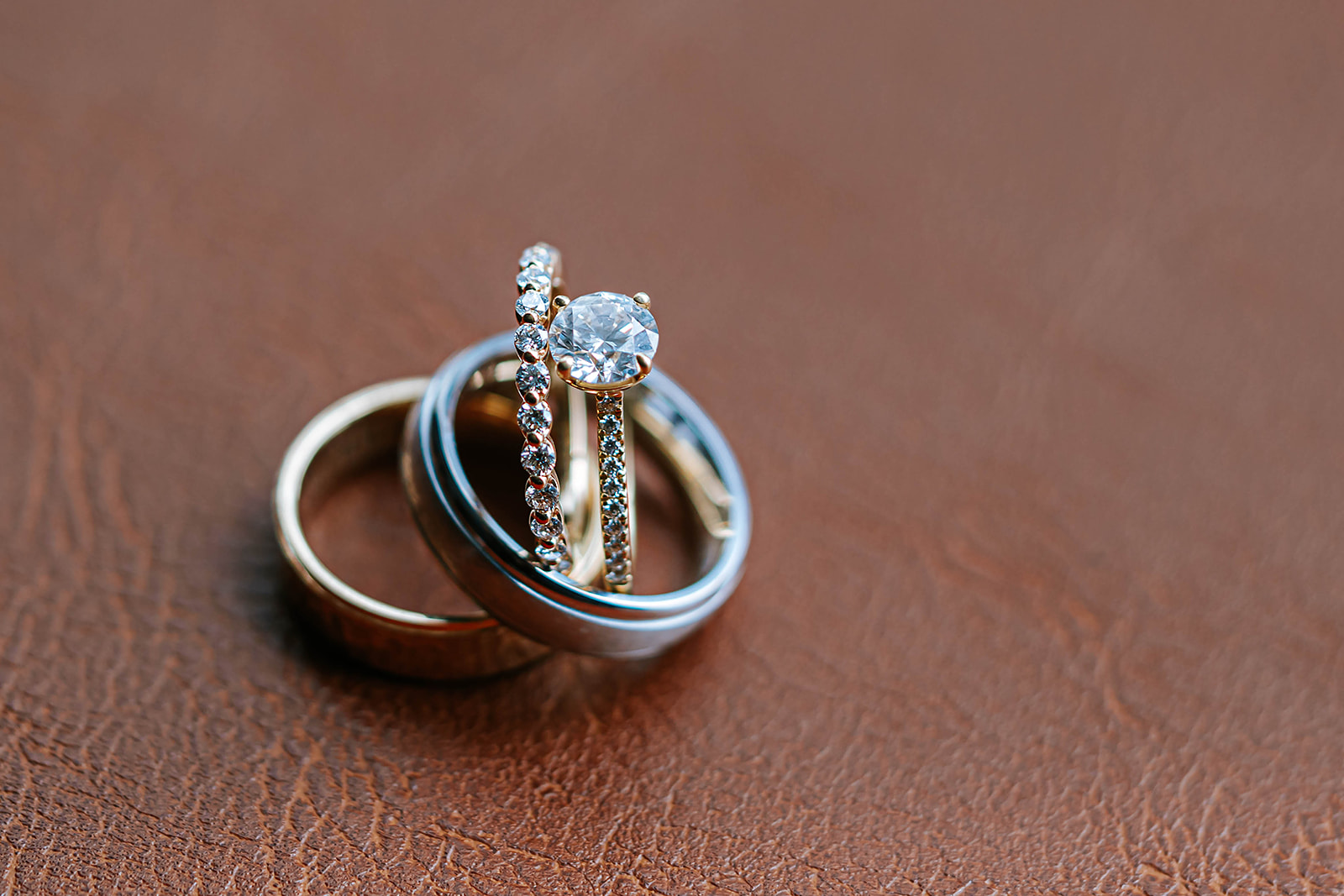 Stacked rings solitaire and band on brown leather