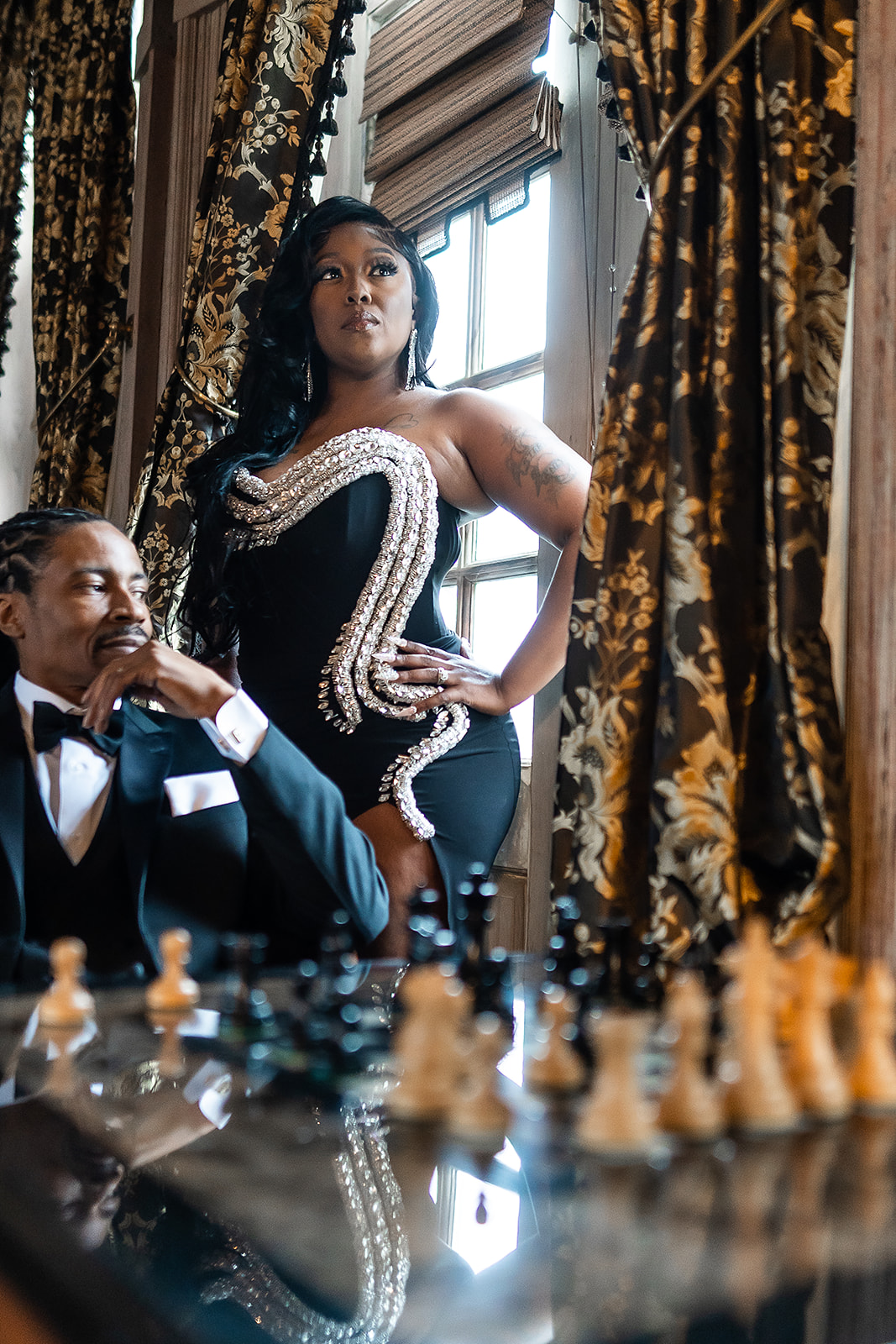 Couple chess glamour portrait at mansion