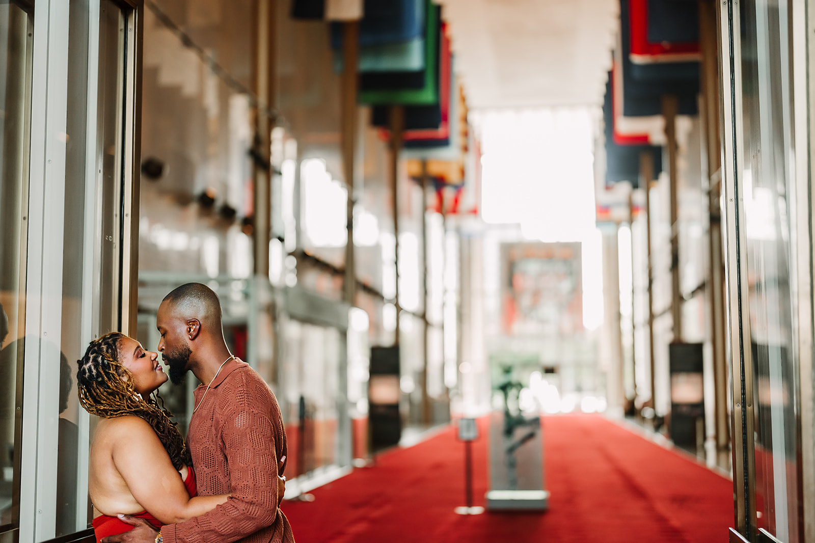 Couple kiss on red carpet at Kennedy Center