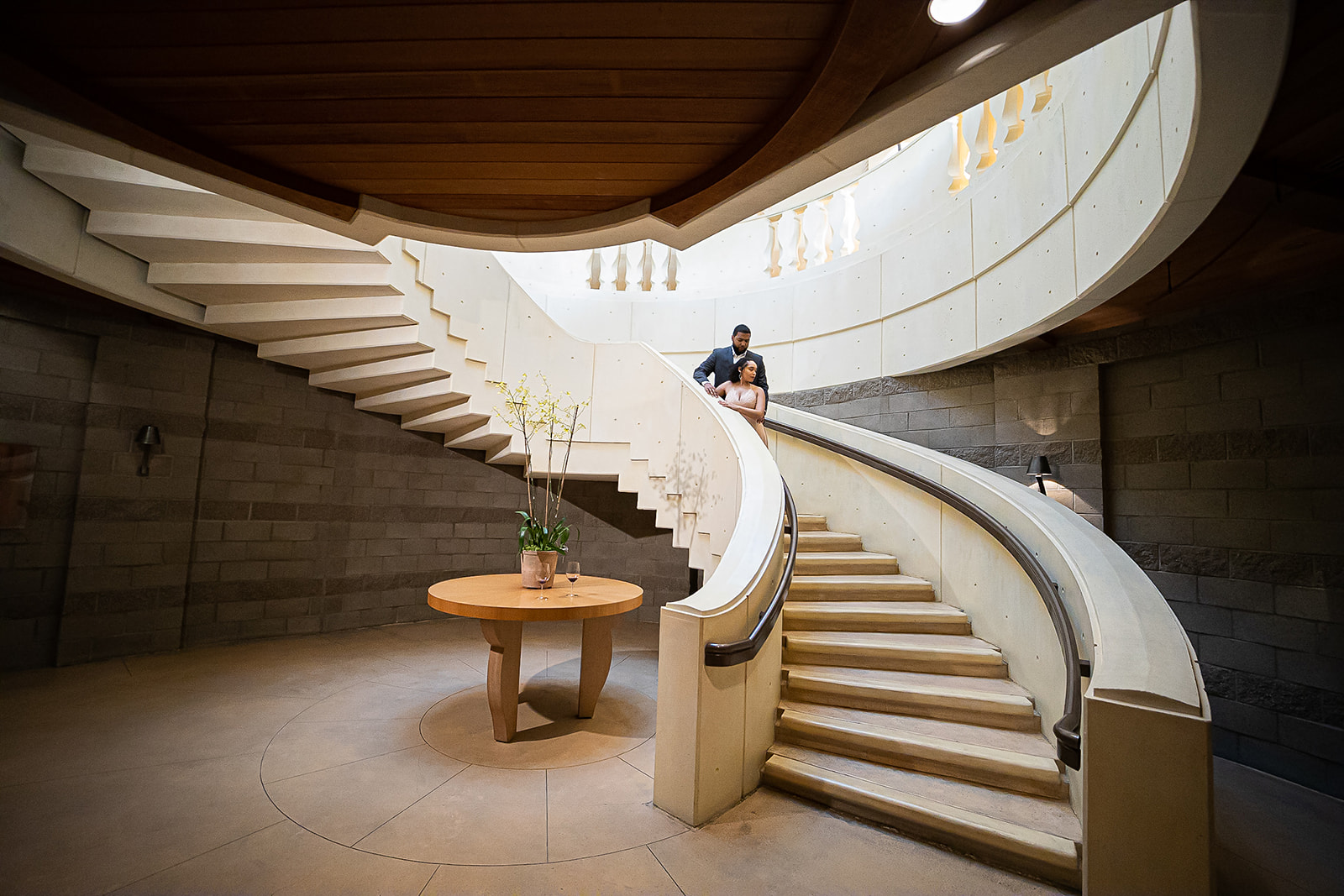 Couple on spiral staircase architectural portrait