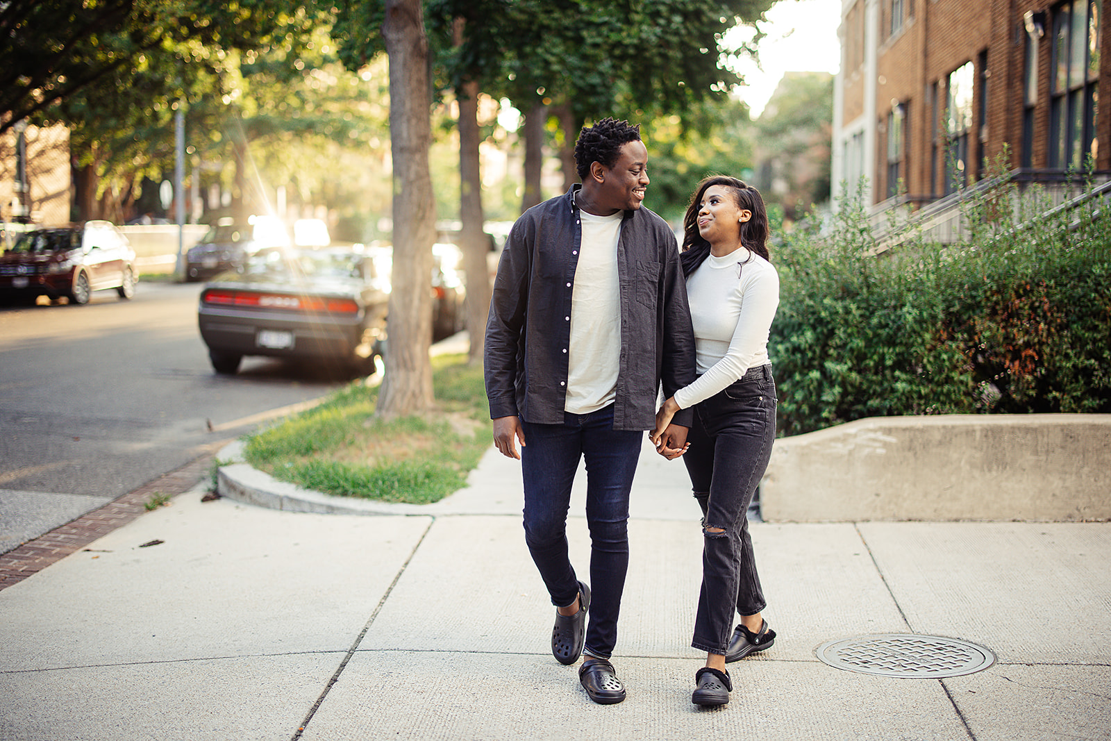 Couple walking on sidewalk casual urban