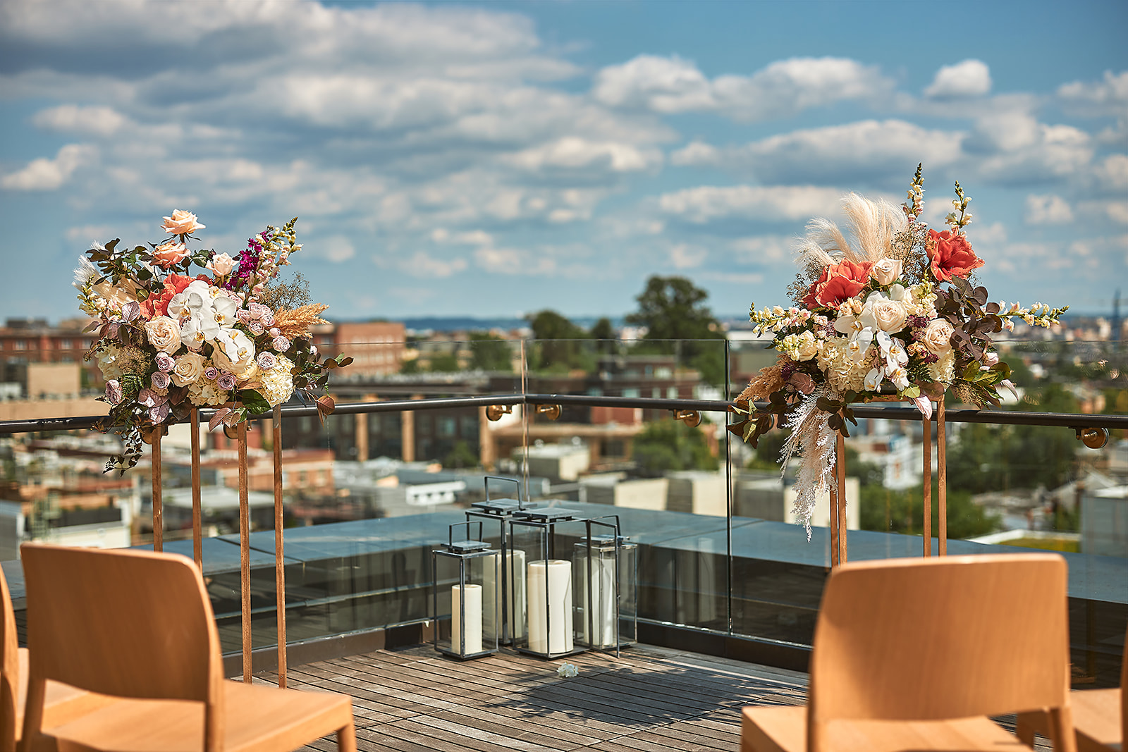 Rooftop ceremony florals pampas grass cityscape blue sky