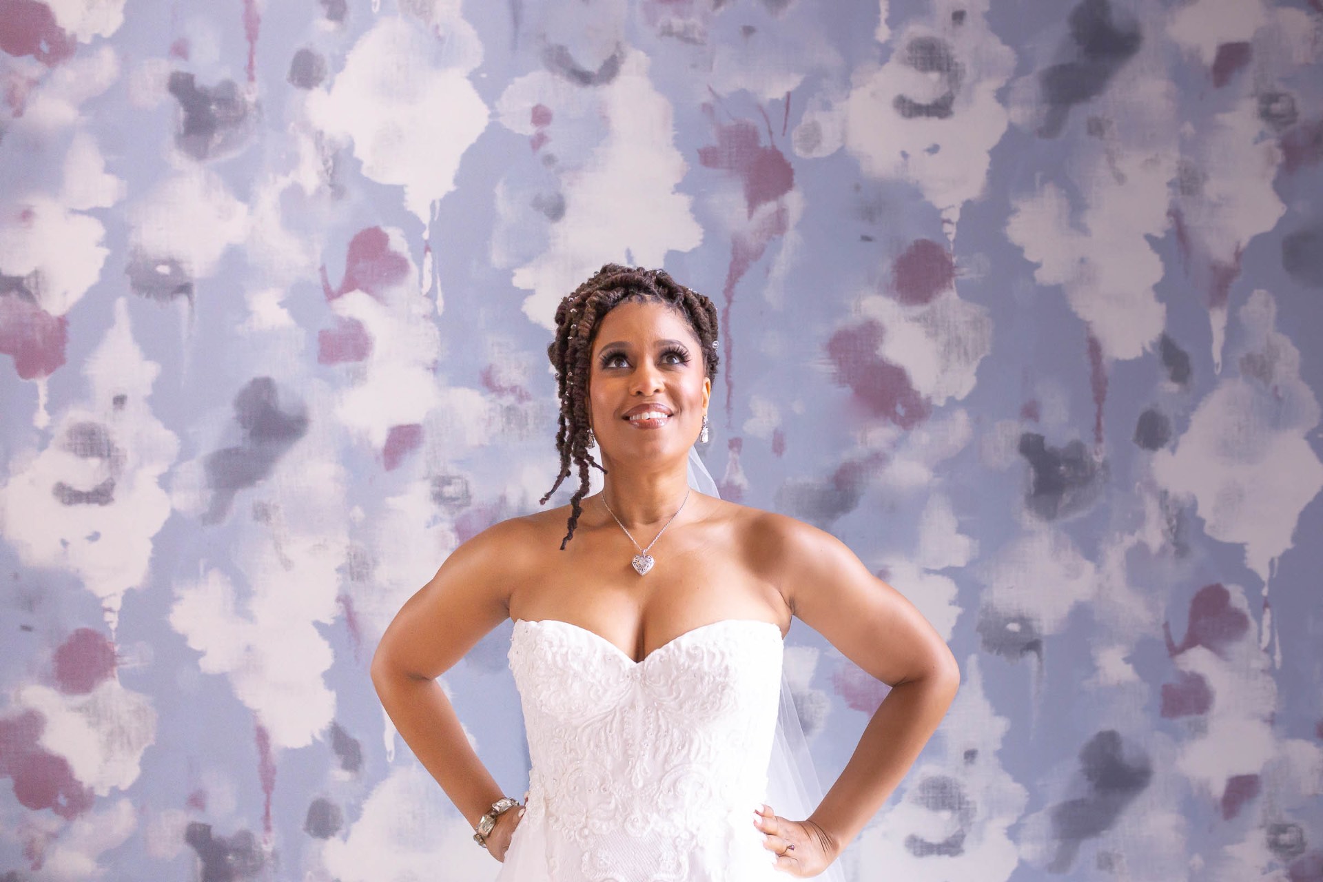 Bride confident portrait against floral wallpaper