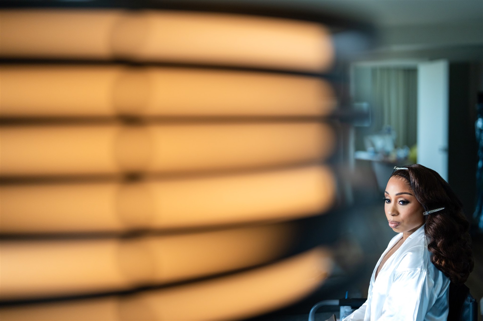 Bride getting ready moody portrait with ring light bokeh