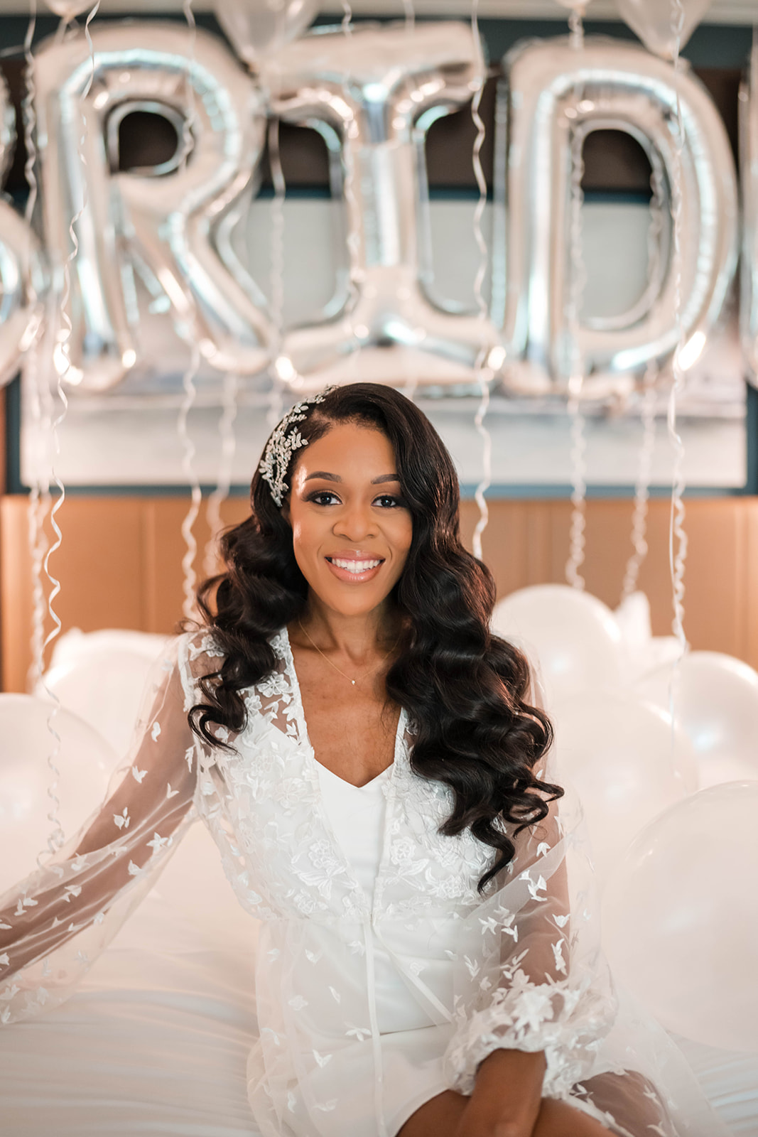 Bride with silver balloons headpiece curls getting ready portrait