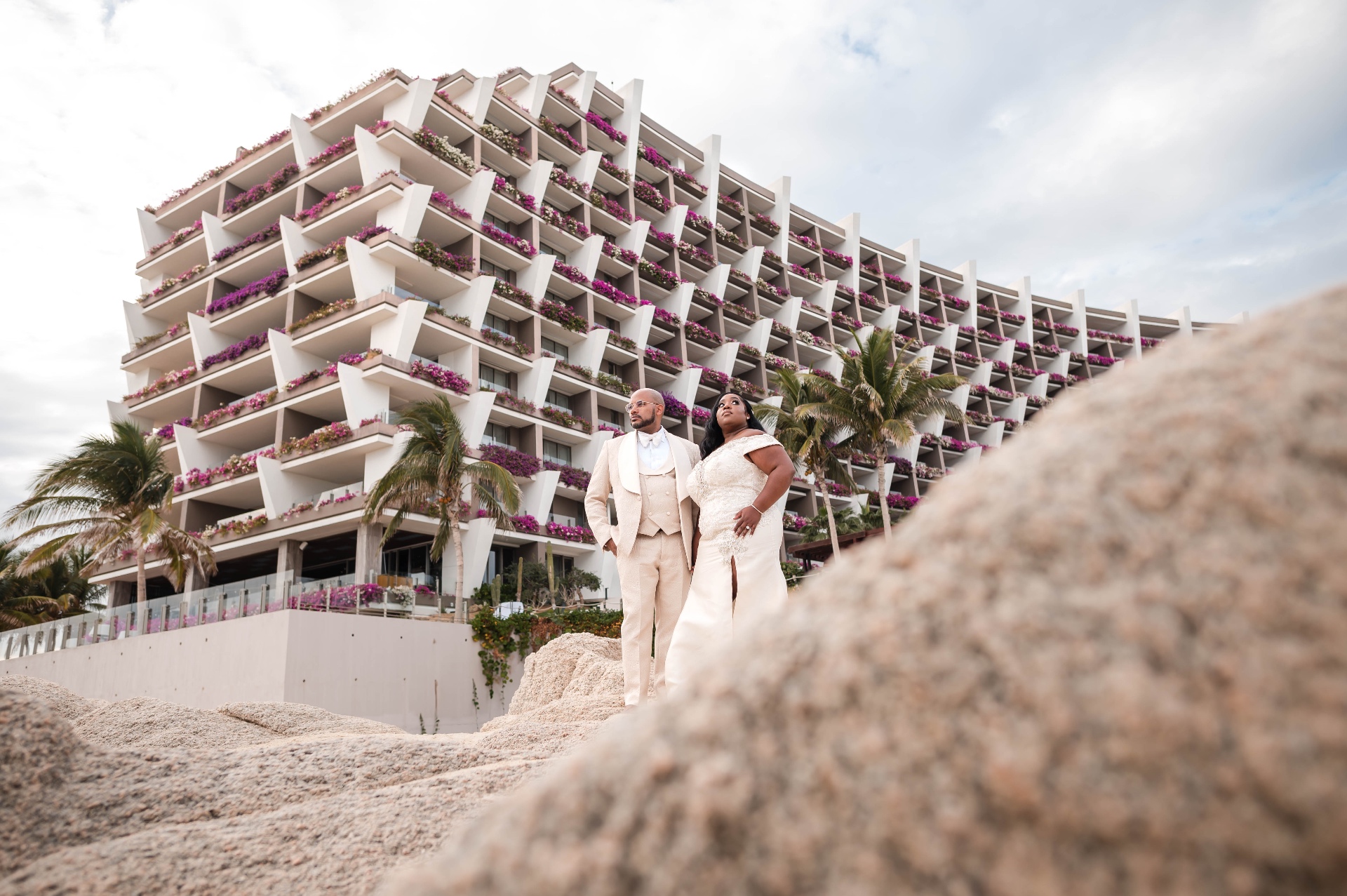 Couple at Los Cabos luxury hotel with bougainvillea destination wedding Mexico