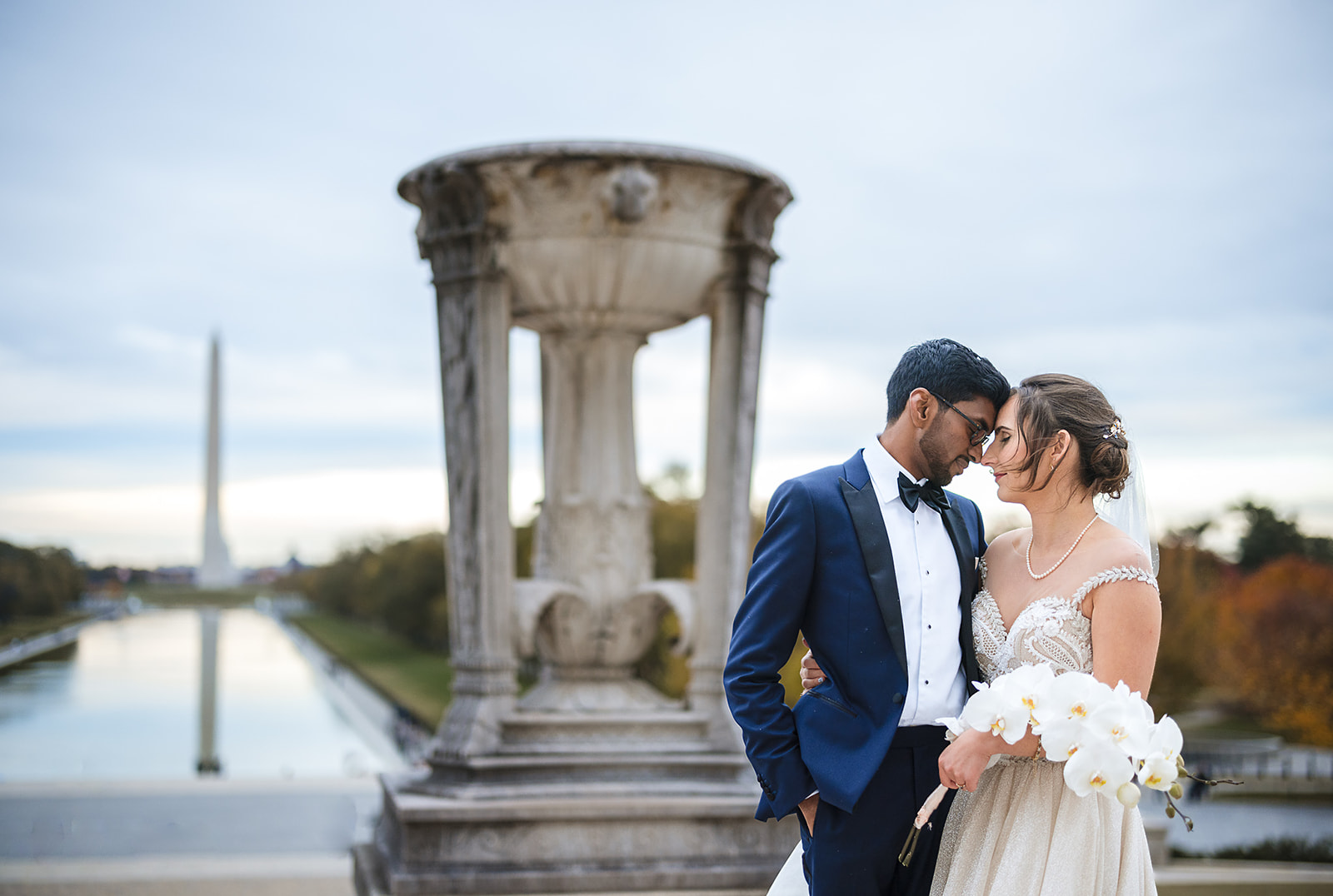 Couple at Washington Monument reflecting pool